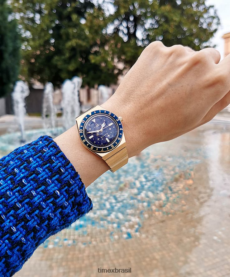 relógios | Q Timex mulheres relógio com banda de expansão de aço inoxidável celestial de 36 mm XFN60X328 tom dourado/azul